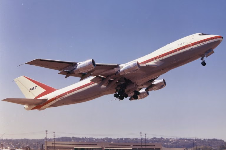 The Boeing 747-121 City of Everett prototype registered as N1352B performing a takeoff from Boeing Field in Seattle during its testing phase in the early 1970s.