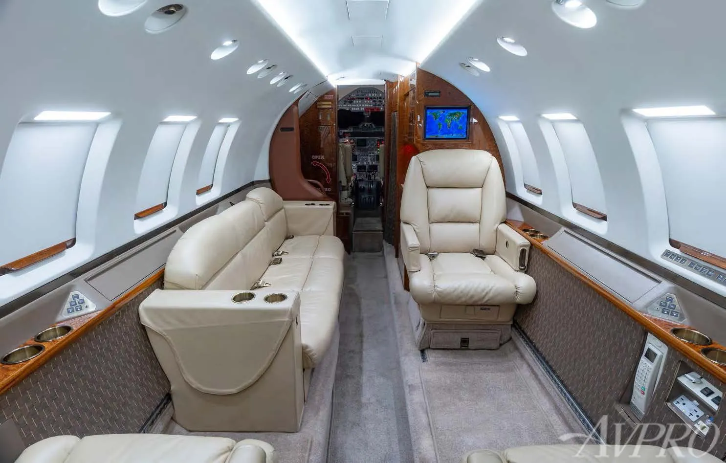 Hawker 800XP executive cabin layout with divan seating and forward cockpit view