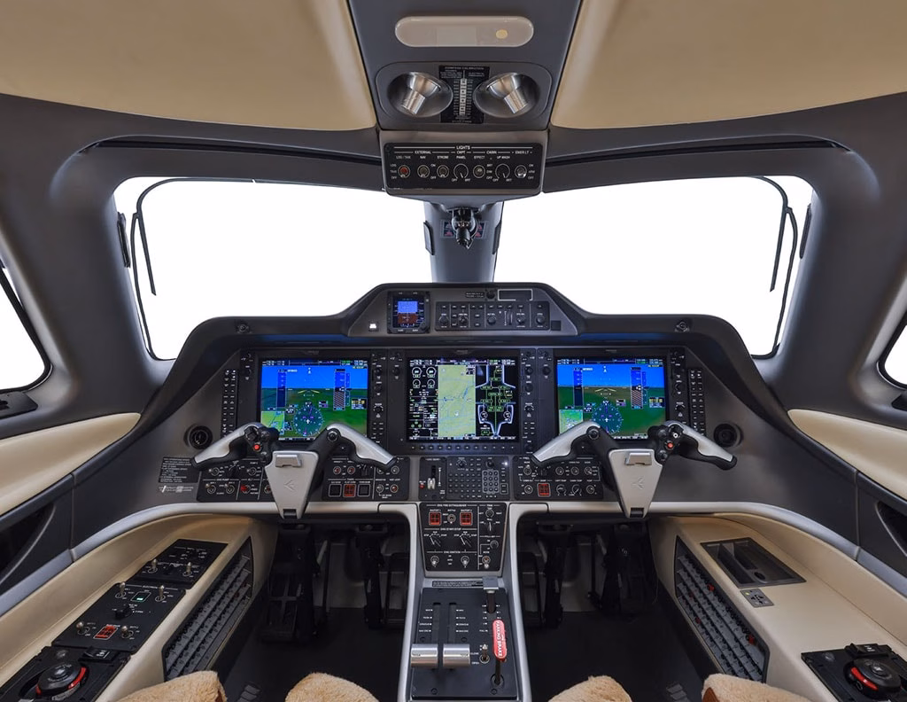 2015 Embraer Phenom 300 cockpit with Garmin Prodigy G1000 avionics suite and dual pilot controls