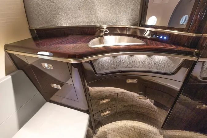 2018 Cessna Citation Latitude lavatory vanity with sink wood cabinetry and premium finishes