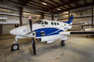 1982 Beechcraft King Air C90 N964GB front left exterior view in hangar