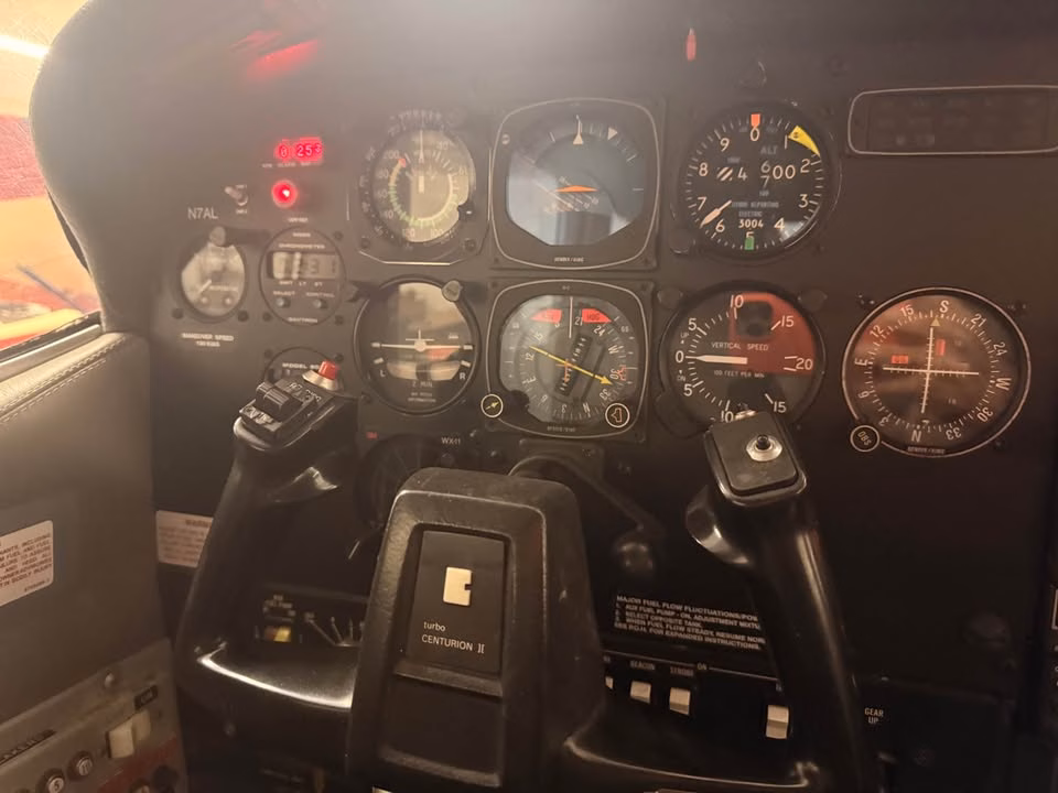 1979 Cessna 210N N7AL pilot instrument panel and control yokes
