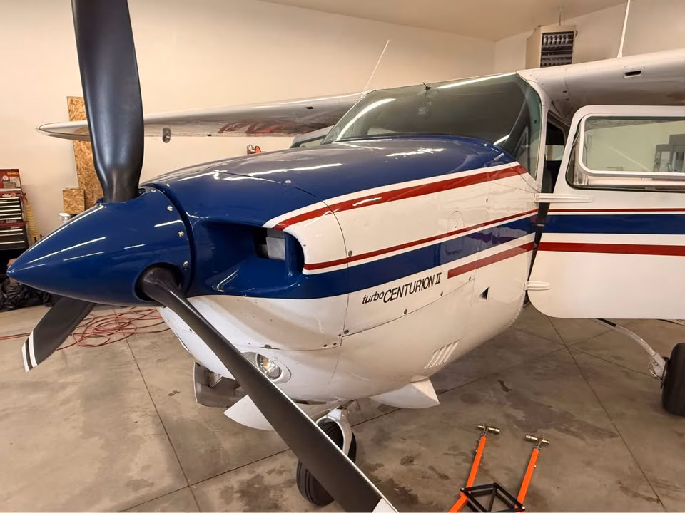 1979 Cessna 210N Turbo Centurion II front left exterior with open cabin door