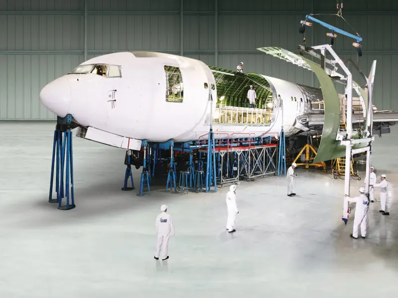 Boeing 747 passenger to freighter conversion work inside an aircraft maintenance hangar